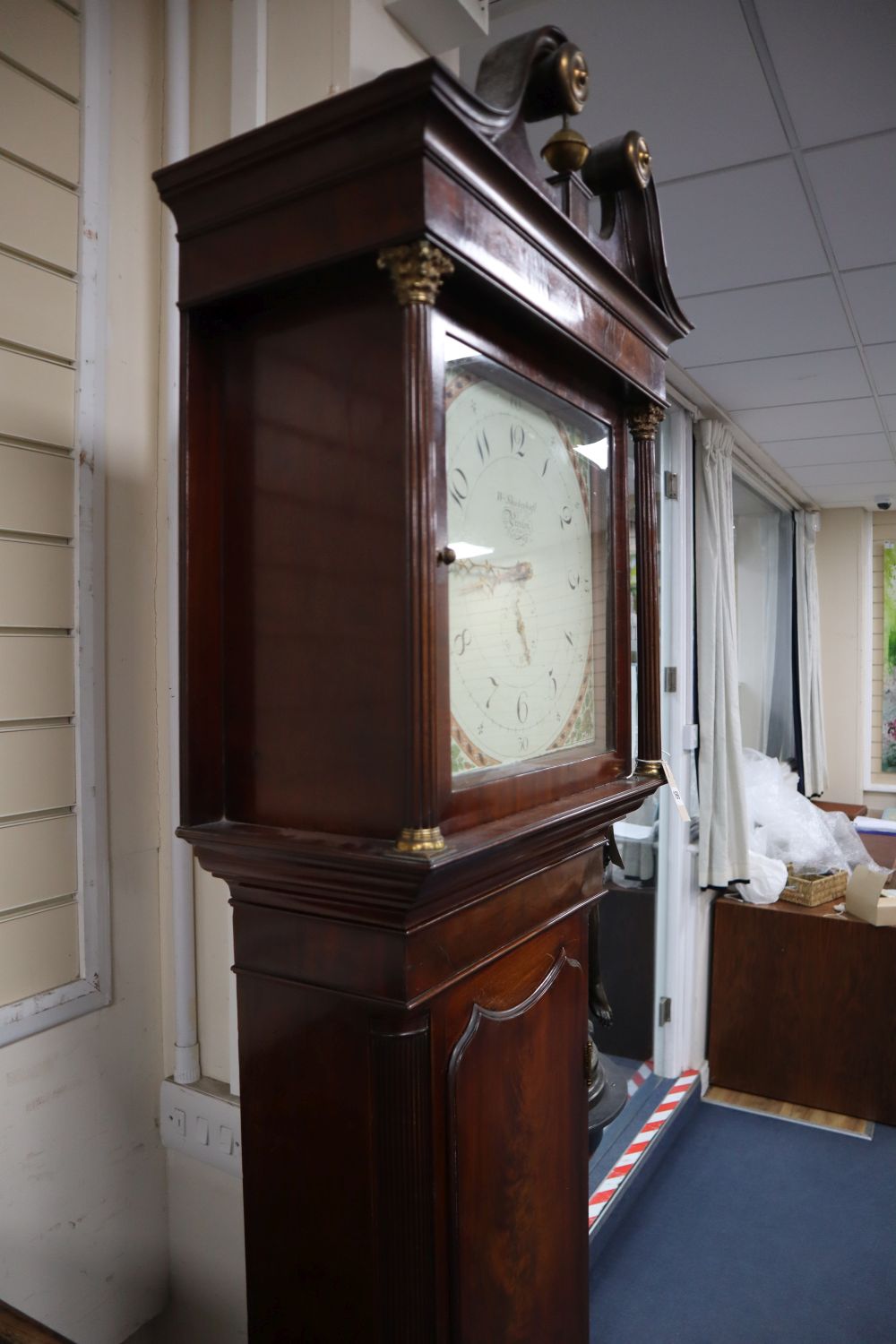 A George III mahogany longcase clock, having thirty-hour movement with 14 inch square dial signed Wm.